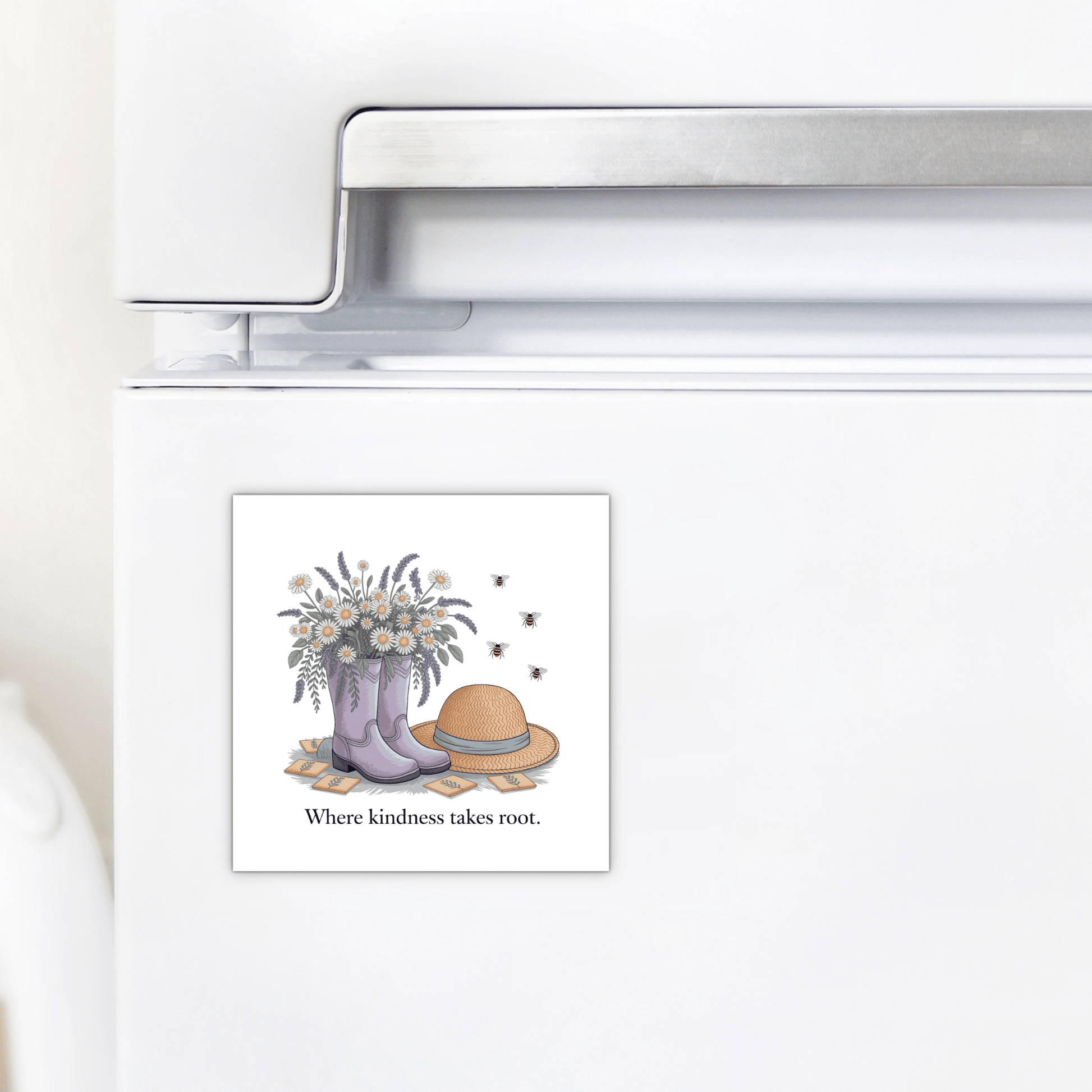 The Kindness Garden Magnet – Floral Boots & Bees Quote by Mirabilia Boutique features purple boots with flowers, bees, a straw hat, and the phrase "Where kindness takes root"—a thoughtful kindness gift for any fridge.