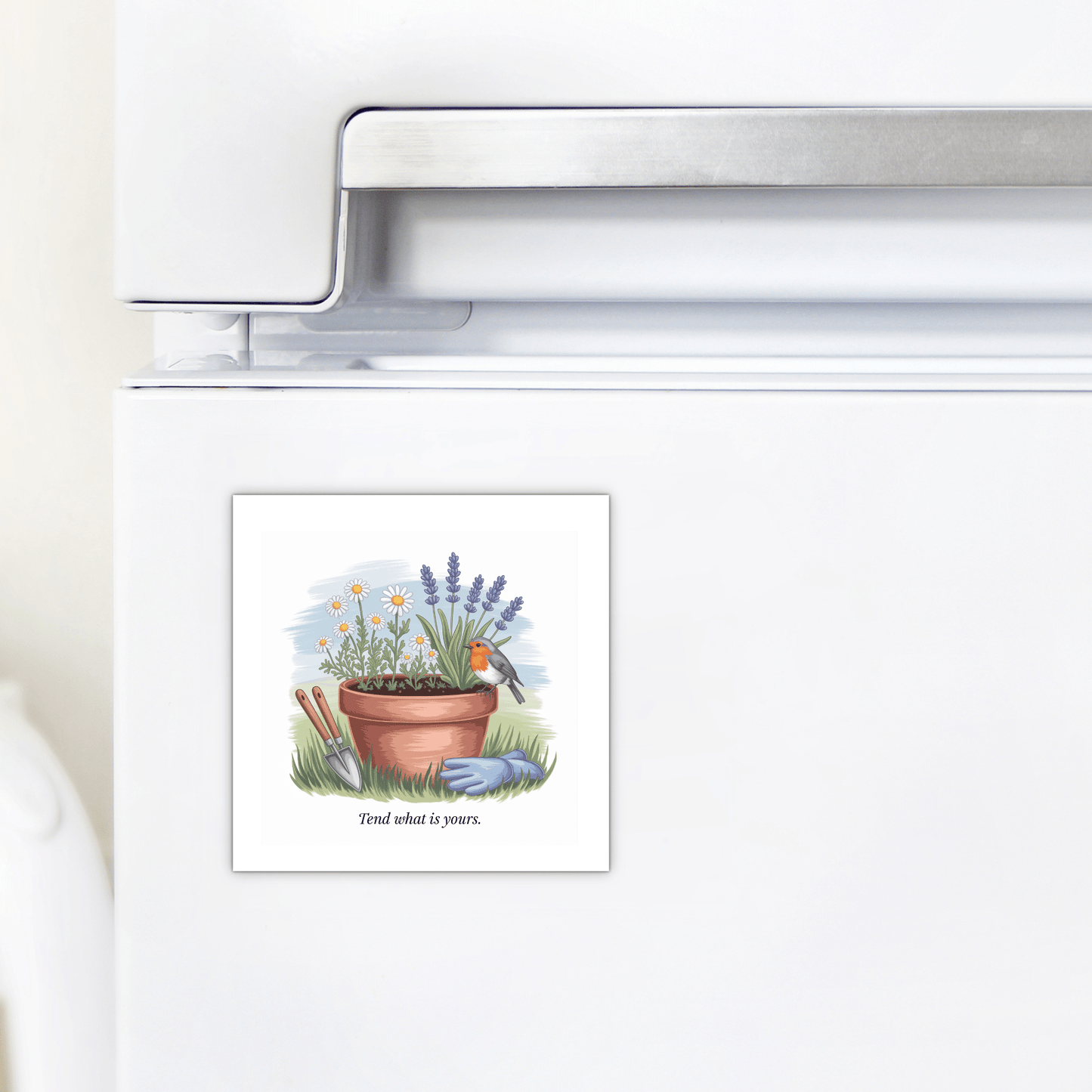The Tend What Is Yours Magnet – Garden Quote with Florals by Mirabilia Boutique features a potted plant, flowers, trowel, gloves, and bird on a white fridge. "Tend what is yours." A perfect inspirational gift for garden lovers.