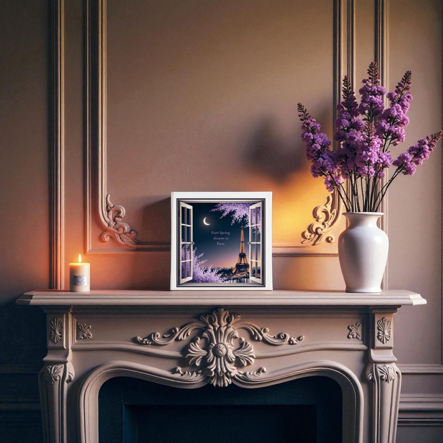 A decorated mantel features a lit candle, a white vase of purple flowers, and Mirabilia Boutique’s 8x8 “Spring Dreams in Paris Canvas – Moonlit Eiffel Tower Art” displayed against an ornate, vintage-style wall.