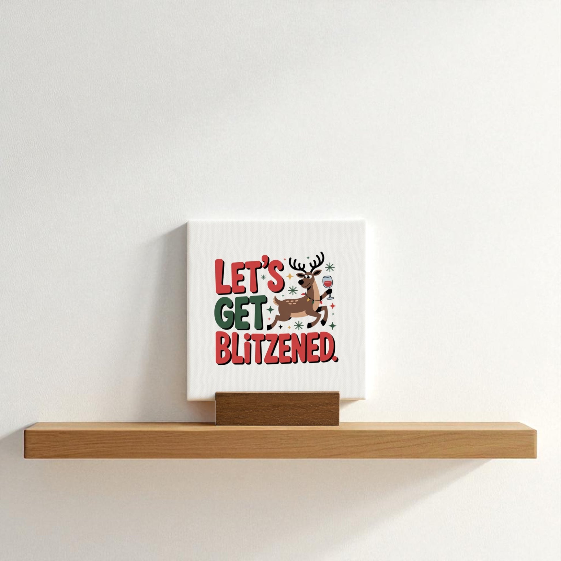 The Mirabilia Boutique Let's Get Blitzened Mini Christmas Sign is a funny holiday decor piece featuring a festive reindeer and the phrase "Let’s get blitzened"—perfect for adding playful charm to your shelf or gifting to wine lovers.