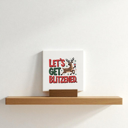 The Mirabilia Boutique Let's Get Blitzened Mini Christmas Sign is a funny holiday decor piece featuring a festive reindeer and the phrase "Let’s get blitzened"—perfect for adding playful charm to your shelf or gifting to wine lovers.
