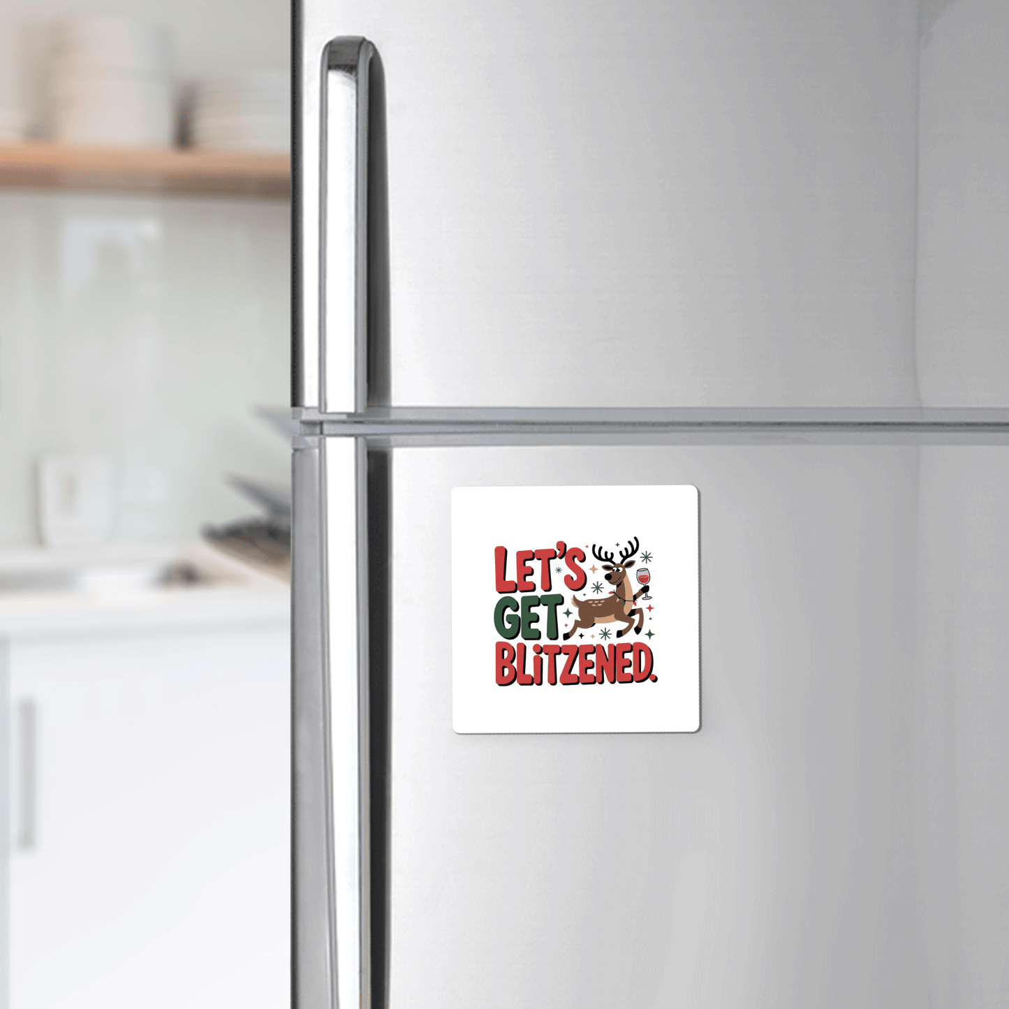 Add holiday cheer to your fridge with the Let's Get Blitzened Magnet by Mirabilia Boutique—a funny Christmas fridge decor featuring a smiling reindeer, perfect as a festive gift for wine lovers.