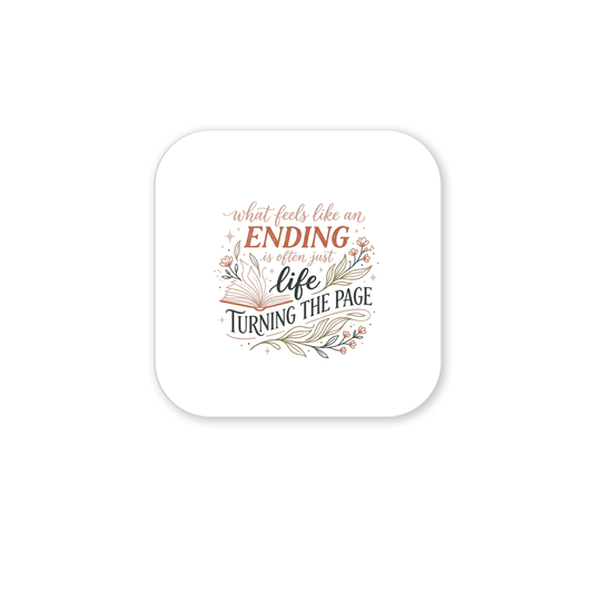 The Life Turning the Page Inspirational Magnet by Mirabilia Boutique features a motivational quote in decorative script, surrounded by floral and leaf designs—perfect as inspirational decor or a thoughtful literary gift.