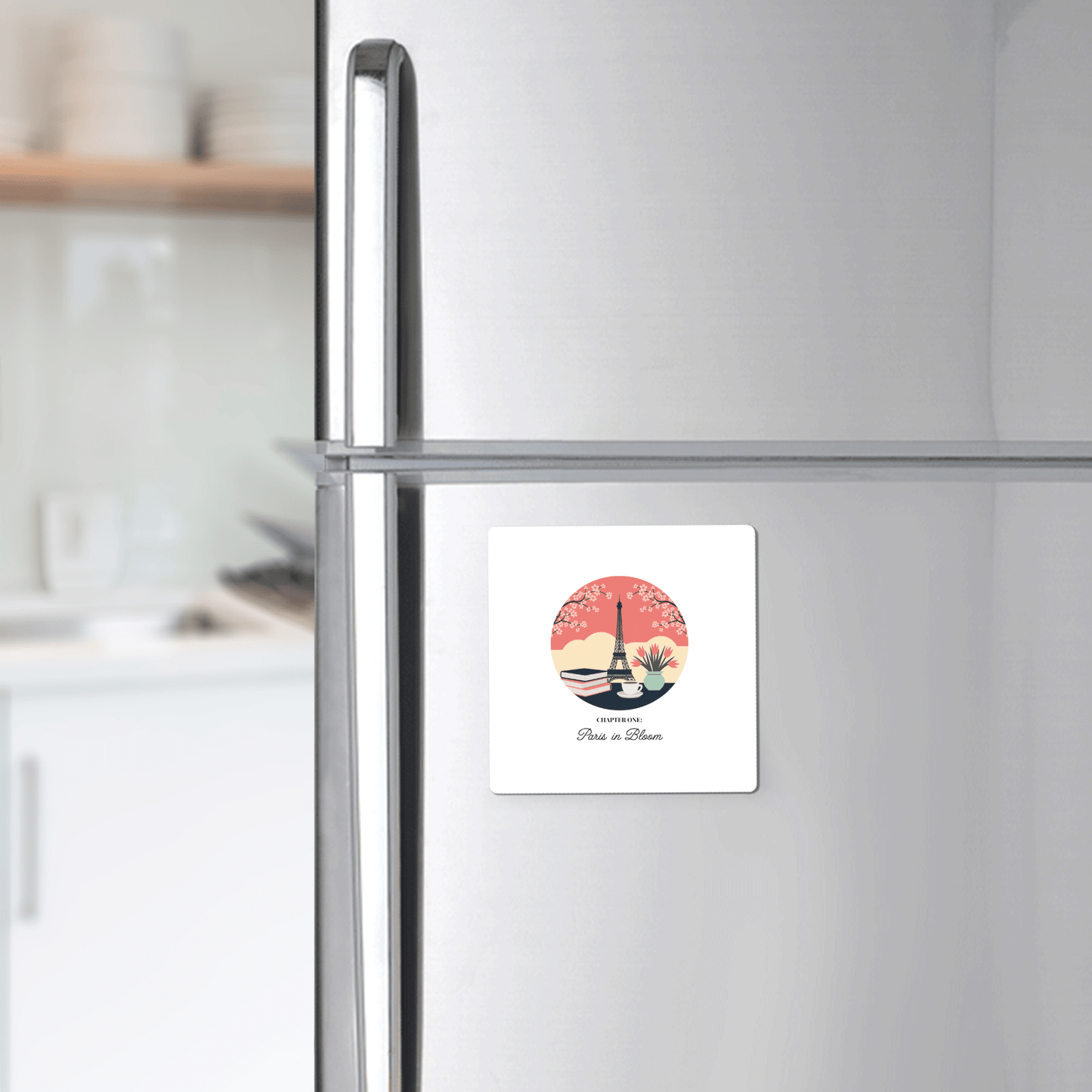 The Paris in Bloom Magnet by Mirabilia Boutique, featuring a literary Paris design for book lovers, adds a charming touch to a stainless steel refrigerator door in any modern kitchen.