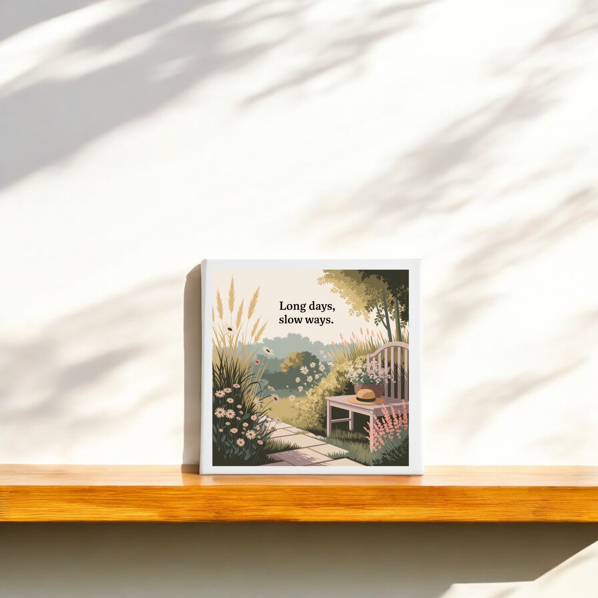 The "Long Days, Slow Ways Canvas – Peaceful Summer Garden Art" by Mirabilia Boutique features a serene illustration of a chair, hat, and flowers. Ideal for calming wall decor, it brings tranquil summer charm to your space.
