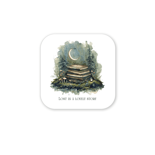 A stack of books rests in a forest clearing illuminated by a crescent moon, encircled by trees, mushrooms, and a gentle lantern glow. The text beneath says, "LOST IN A LOVELY STORY." The Lost in a Lovely Story Book Lover Magnet by Mirabilia Boutique is a handcrafted piece that makes a delightful literary gift for any book enthusiast.