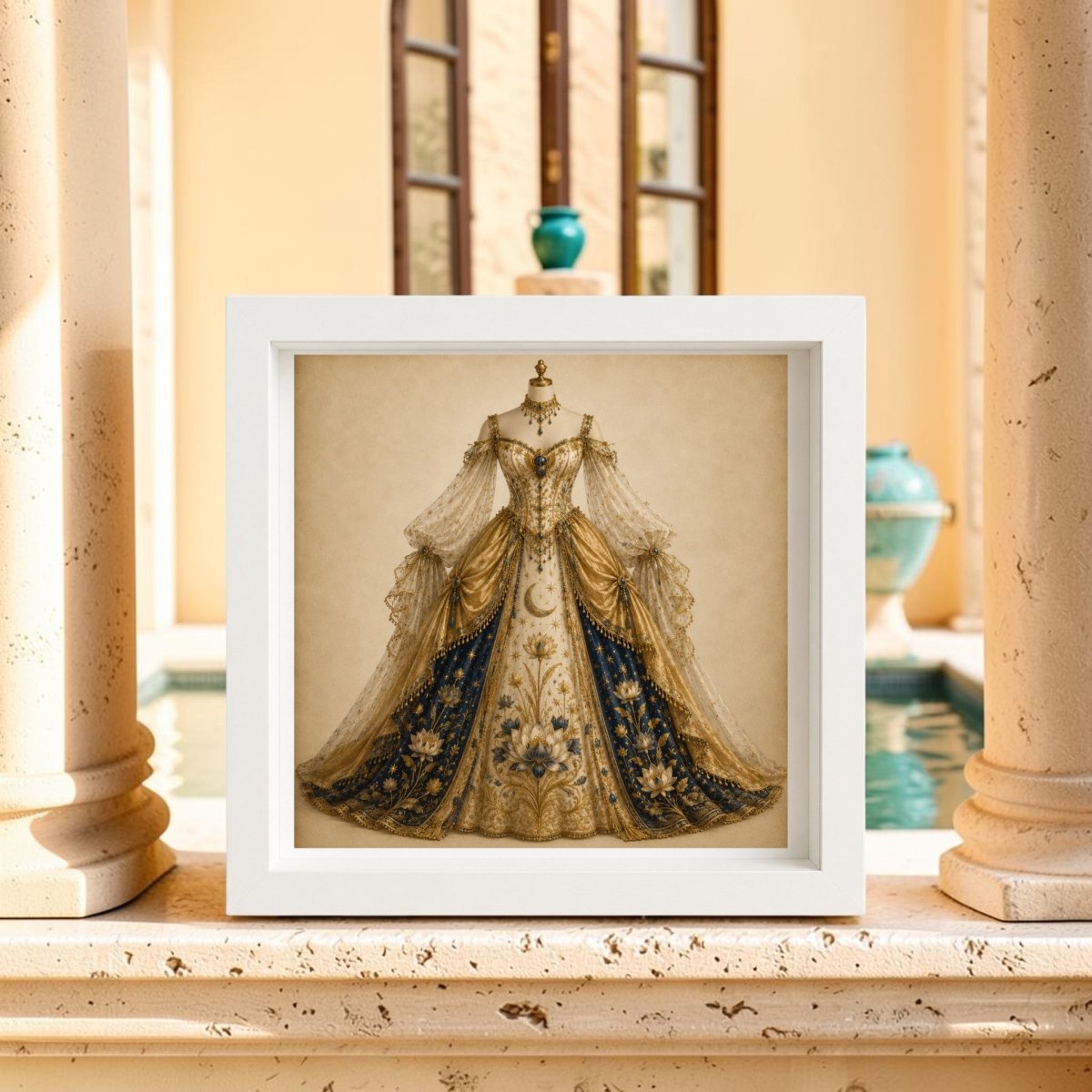 A framed canvas photo titled “Lotus of the Heavens | Curated Couture Artwork” by Mirabilia Boutique showcases an ornate royal blue and gold gown on a dress form, displayed on a ledge before columns with a pool and expansive windows in the background, evoking the elegance of celestial artwork.