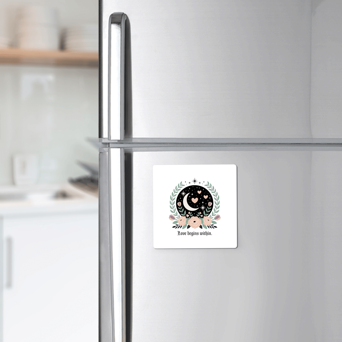 The Love Begins Within Magnet by Mirabilia Boutique, a square self-love gift with celestial and floral designs, adds inspiration to your fridge with its crescent moon, stars, and hearts, reminding you that love starts from within.