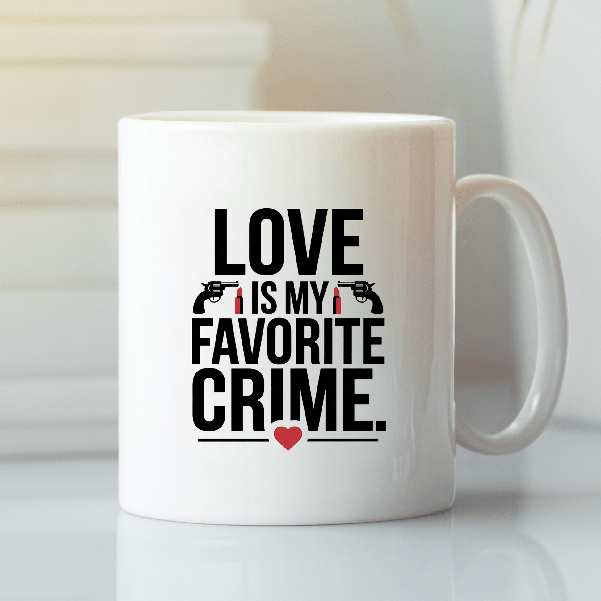 The Mirabilia Boutique "Love Is My Favorite Crime Mug" features bold black text, small handguns, and a red heart—making it the perfect true crime Valentine gift for fans and podcast lovers.