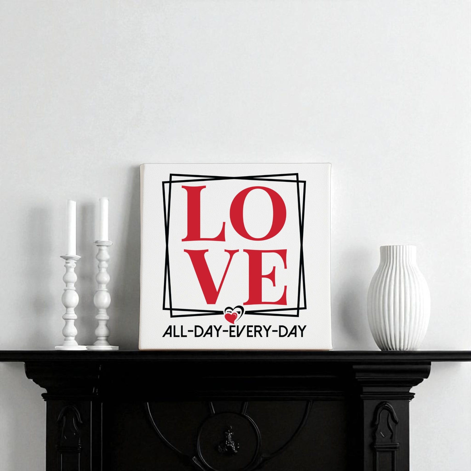 The Mirabilia Boutique Love Wall Art Print | All Day Every Day features bold red letters and modern design, perfect for any space. Stylish on a black mantel with candles and a vase, it makes a chic romantic gift and brings minimalist flair to your decor.
