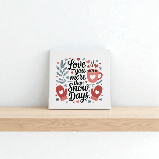 The Love You More Than Snow Days Print by Mirabilia Boutique features mittens, a mug, pine branches, and snowflakes—ideal as winter wall art décor or a romantic holiday gift.