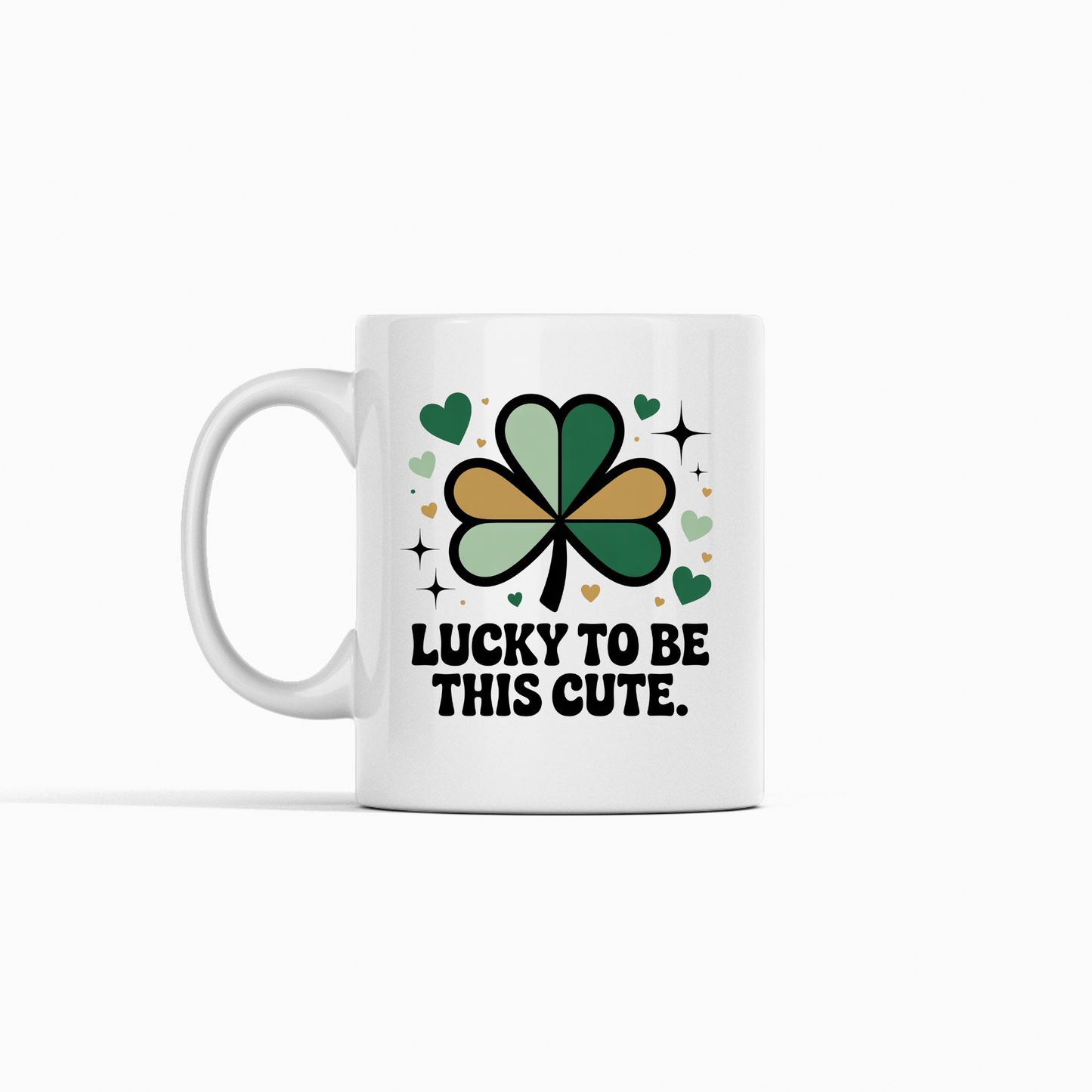 The Lucky to Be This Cute Shamrock Mug by Mirabilia Boutique features a green and gold shamrock, hearts, sparkles, and the phrase "Lucky to be this cute."—a charming self-love mug and perfect gift.