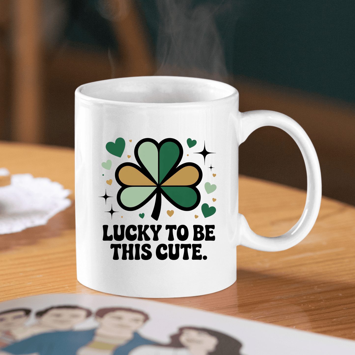 The Lucky to Be This Cute Shamrock Mug by Mirabilia Boutique features a green and black shamrock, hearts, sparkles, and the phrase “Lucky to be this cute”—a cheerful self-love gift mug perfect for spreading positivity.