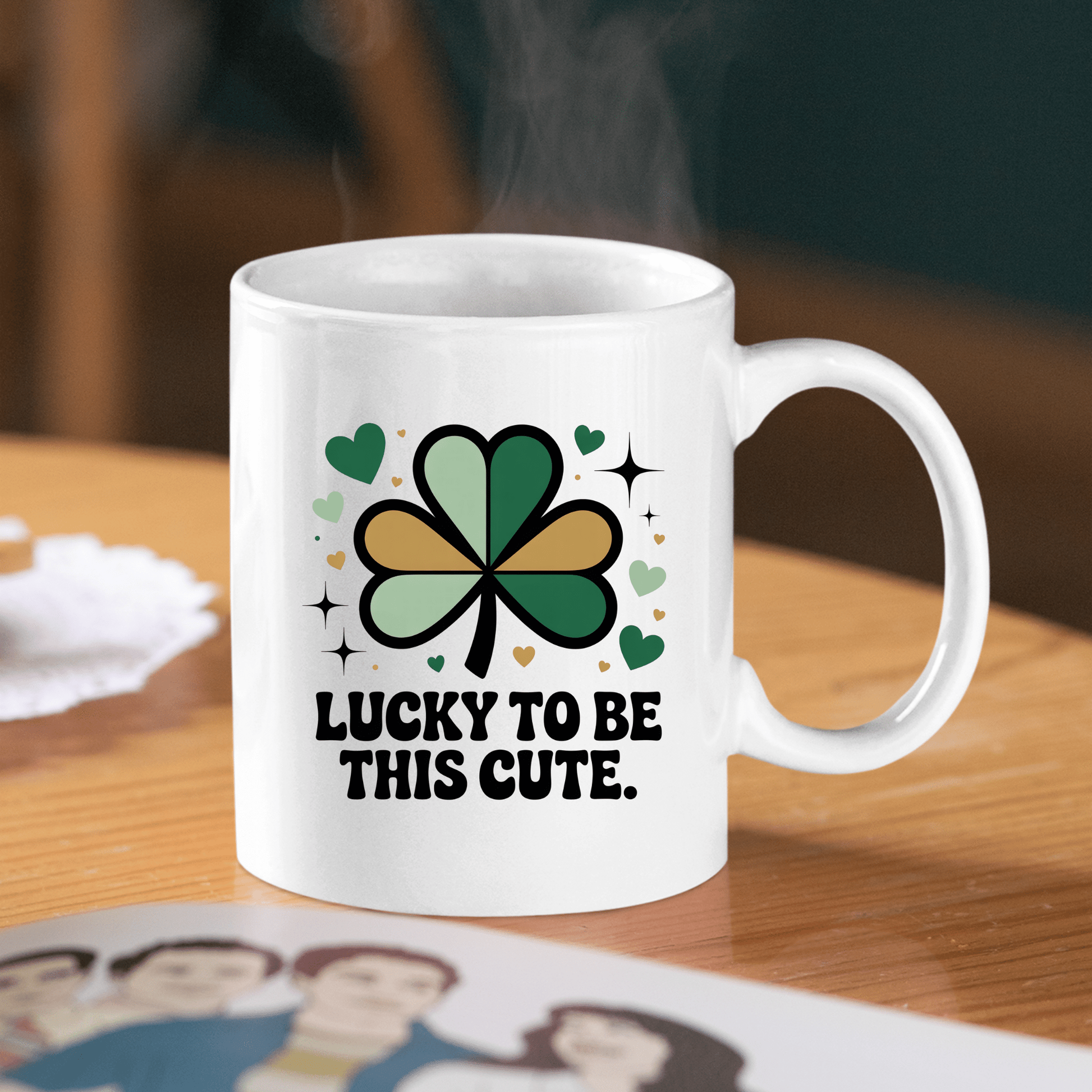 The Lucky to Be This Cute Shamrock Mug by Mirabilia Boutique features a green and black shamrock, hearts, sparkles, and the phrase “Lucky to be this cute”—a cheerful self-love gift mug perfect for spreading positivity.