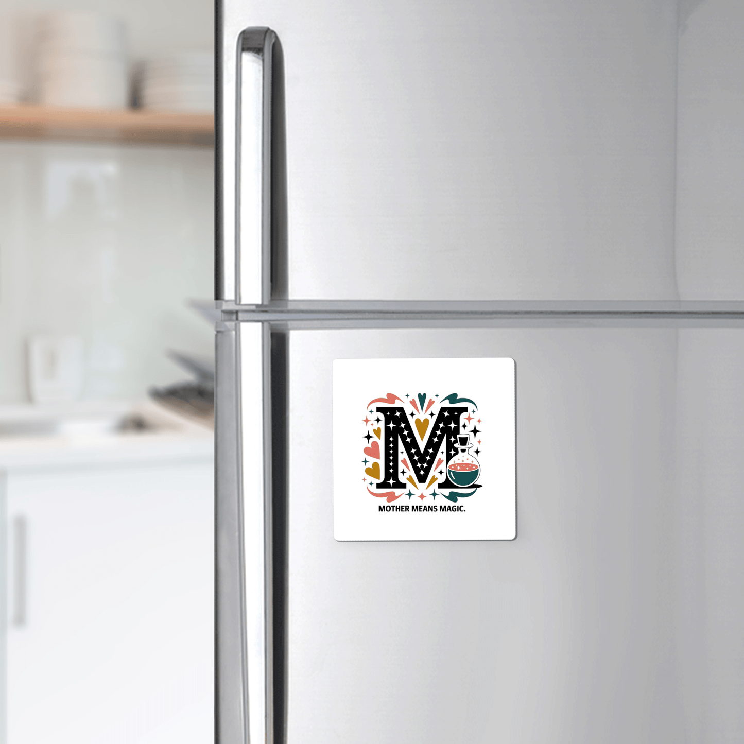 The Mother Means Magic Magnet from Mirabilia Boutique features a colorful "M" and sweet message—adding whimsy to your fridge. A charming Mother's Day gift for your magical mom!.