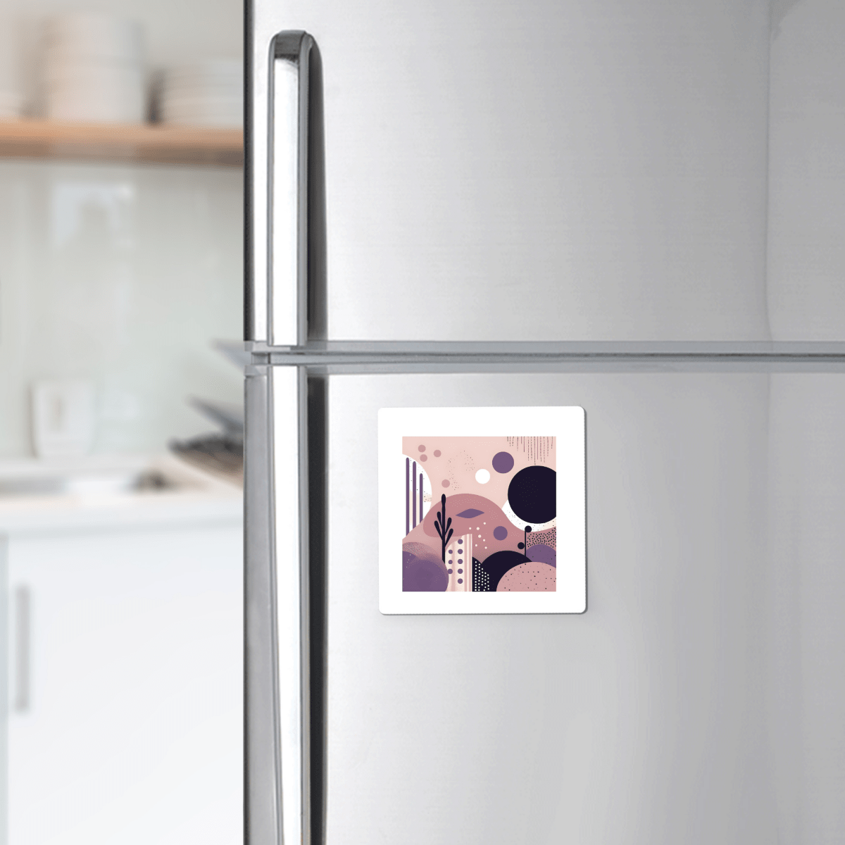 The Purple Dusk Mid Century Modern Magnet by Mirabilia Boutique, featuring pastel geometric shapes, decorates a silver refrigerator door and adds a stylish accent to any modern kitchen.