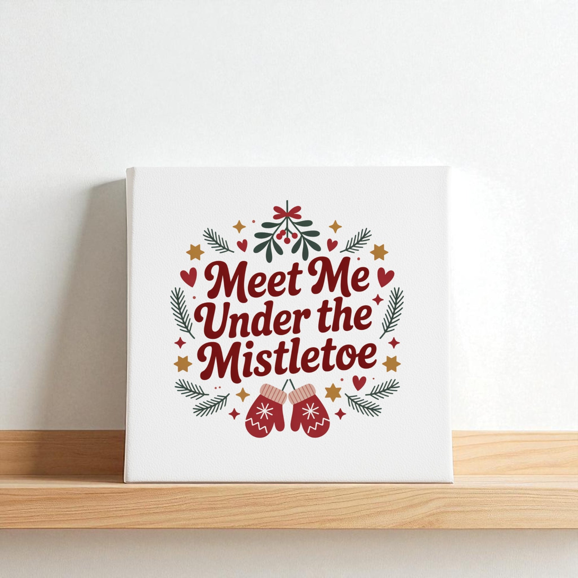 The Mirabilia Boutique "Meet Me Under the Mistletoe" 8x8 canvas sign features festive stars, hearts, mittens, pine branches, and berries—a charming holiday decor piece or Christmas gift.