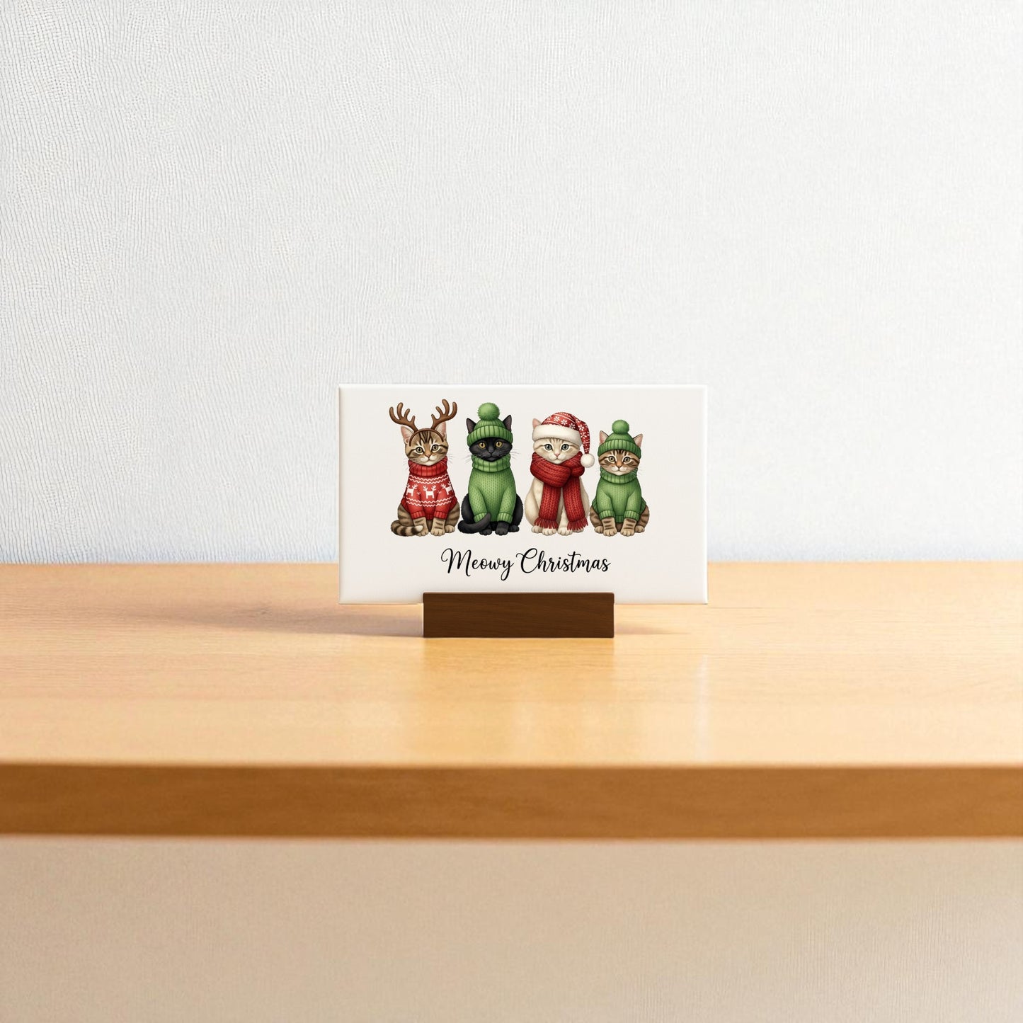 The Meowy Christmas Cat Sign mini canvas by Mirabilia Boutique features four festive gnome cats and "Meowy Christmas" text, making it the perfect cute holiday decor or cat lover gift.