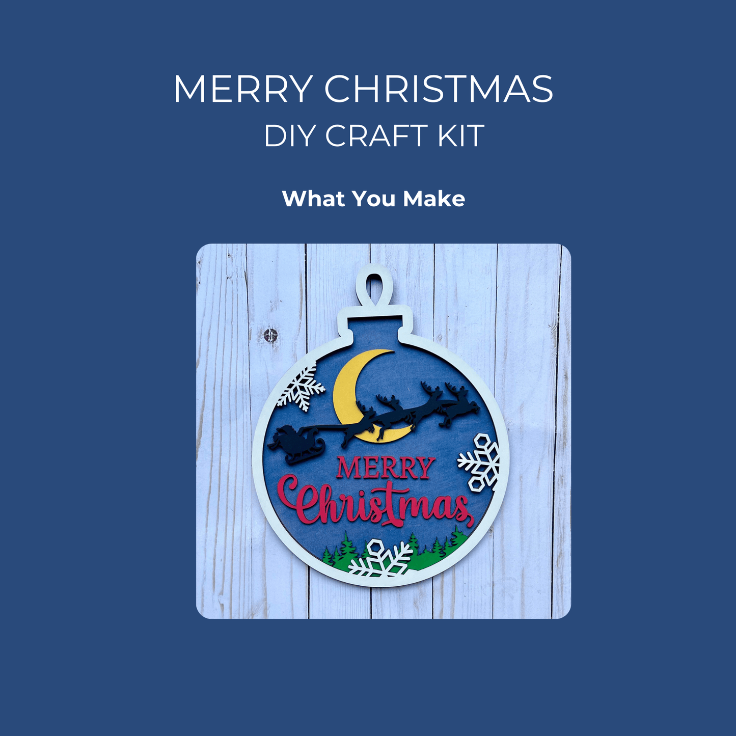 The Merry Christmas DIY Ornament Sign Kit by Mirabilia Boutique features a Santa sleigh, crescent moon, snowflakes, and trees on a blue wood background—perfect for painting your own festive holiday sign.