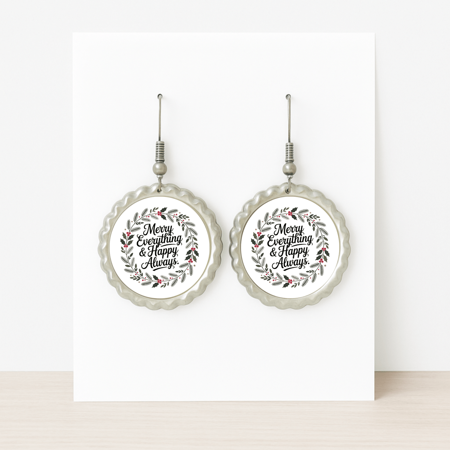 The Merry Everything Earrings by Mirabilia Boutique feature scalloped edges and a festive wreath with "Merry Everything & Happy Always," making them the perfect holiday jewelry or Christmas gift for her, shown on a white background.