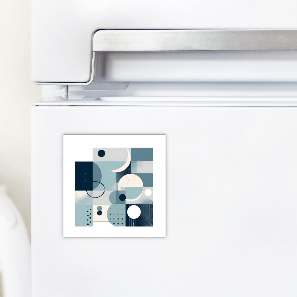 The Moonlit Geometry Mid Century Modern Magnet by Mirabilia Boutique, featuring blue, white, and gray geometric shapes, adds retro charm to any white refrigerator.