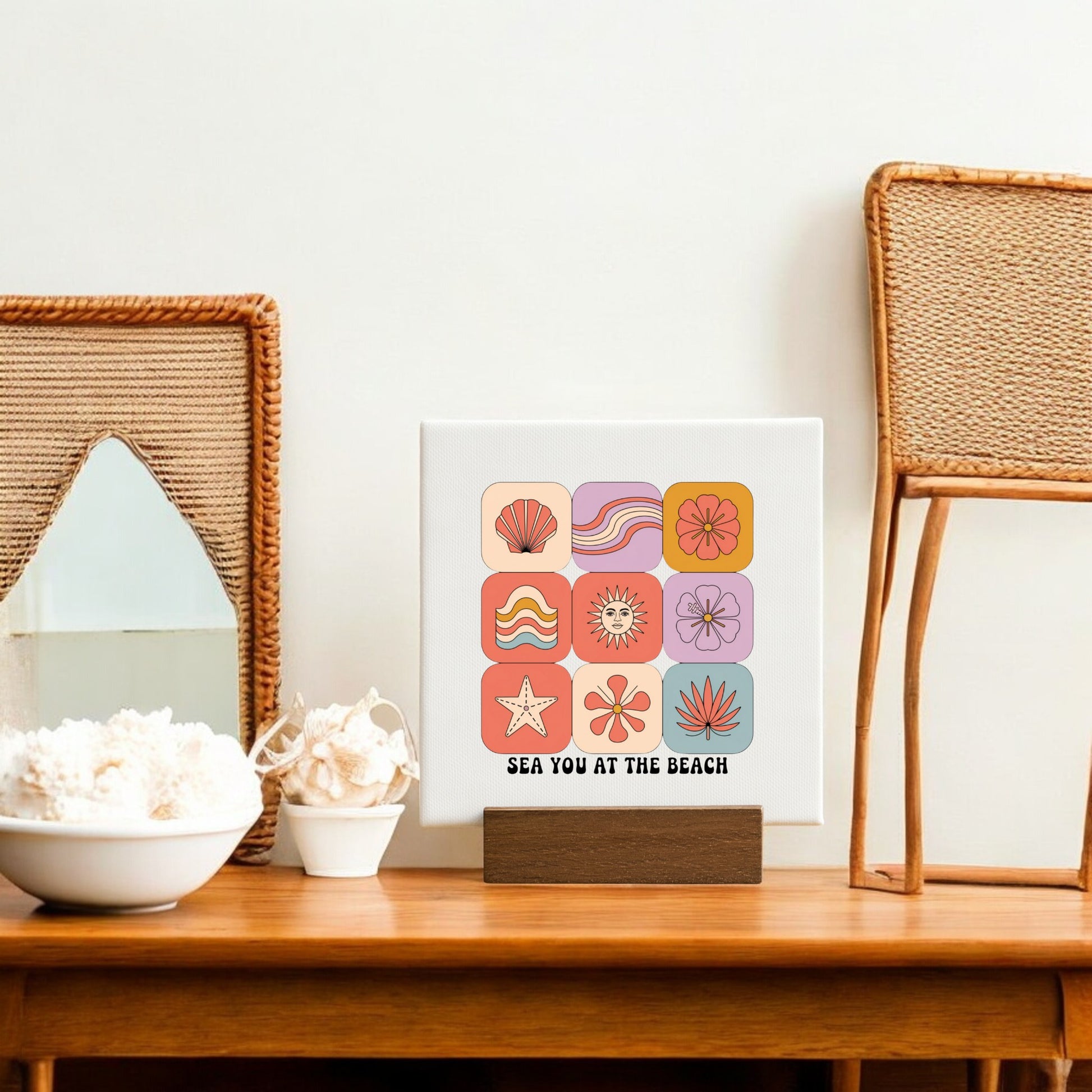 The Sea You at the Beach Mini Canvas – Coastal Summer Vibes by Mirabilia Boutique features colorful beach icons and uplifting text on a wooden stand—perfect coastal decor for bright, airy spaces.
