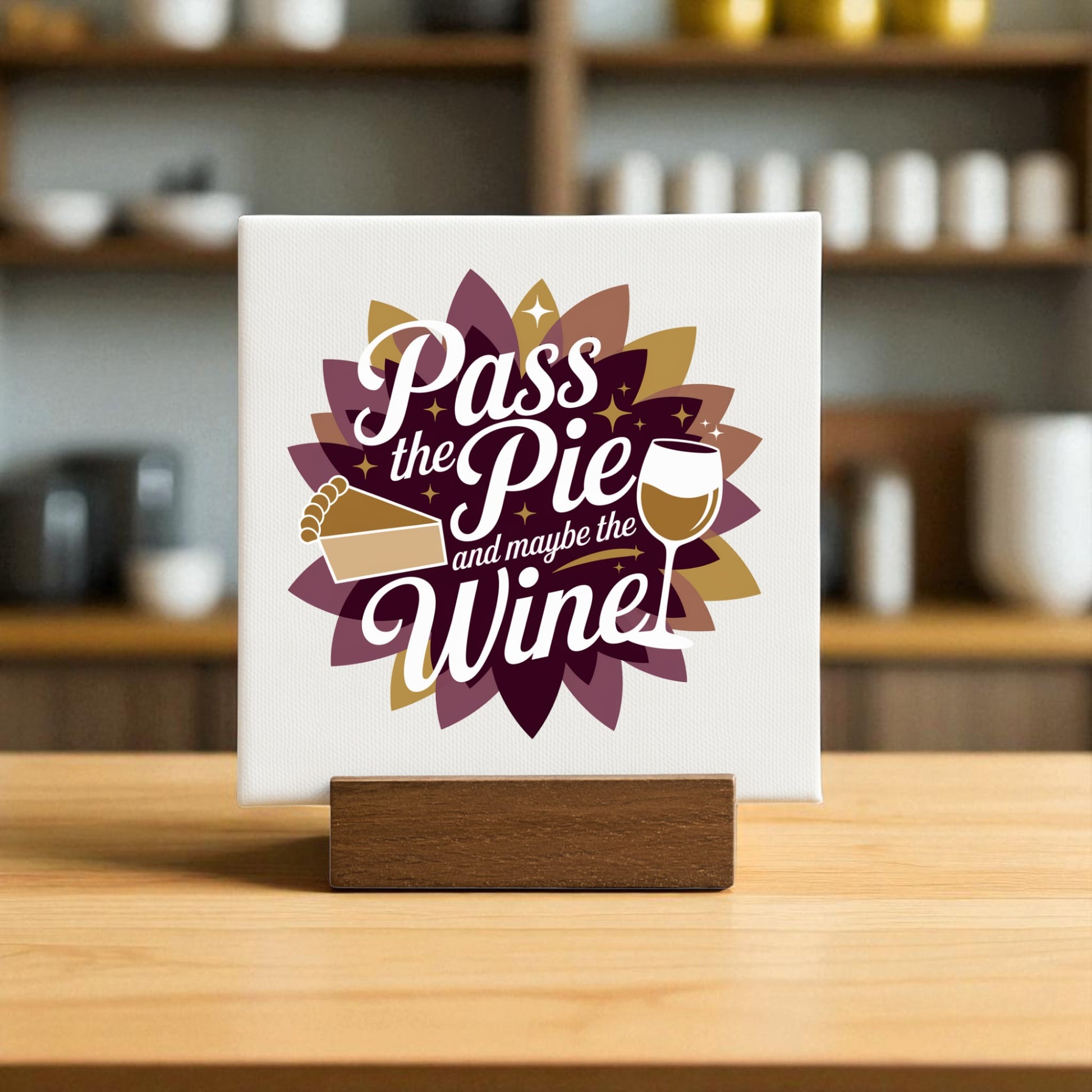 The Mirabilia Boutique "Pass the Pie and Maybe the Wine" Mini Fall Sign is a Thanksgiving decor piece with pie and wine icons on a floral background—ideal for kitchen counters or as a gift for wine lovers.