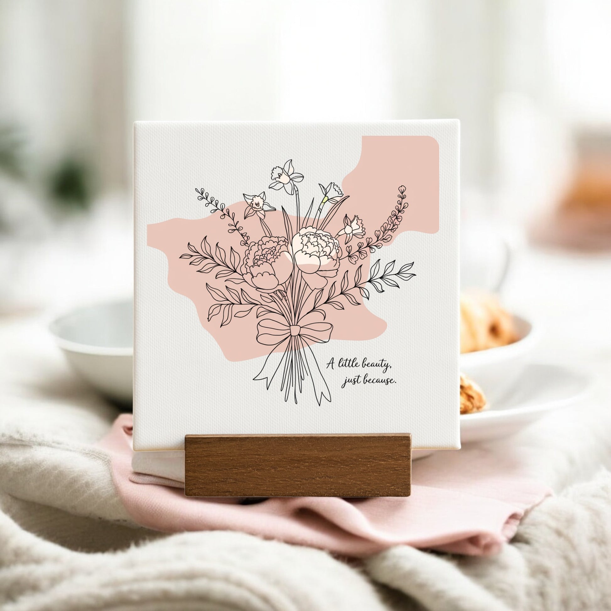 The Mirabilia Boutique "A Little Beauty Mini Canvas – Just Because Floral Sign" features a minimalist floral line drawing with pink accents and uplifting words, making it an ideal gift or minimalist décor piece.