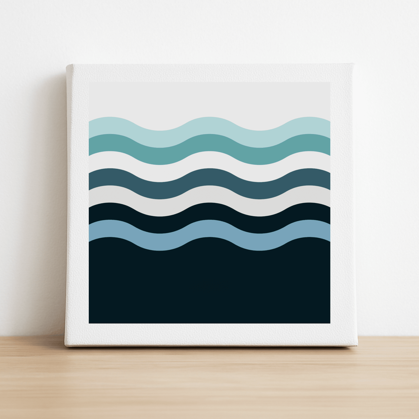 The Keep a Soft Course Canvas Sign by Mirabilia Boutique is an 8x8 framed minimalist print with six wavy blue and teal lines on white—a calming ocean-inspired decor piece perfect for coastal wall art.