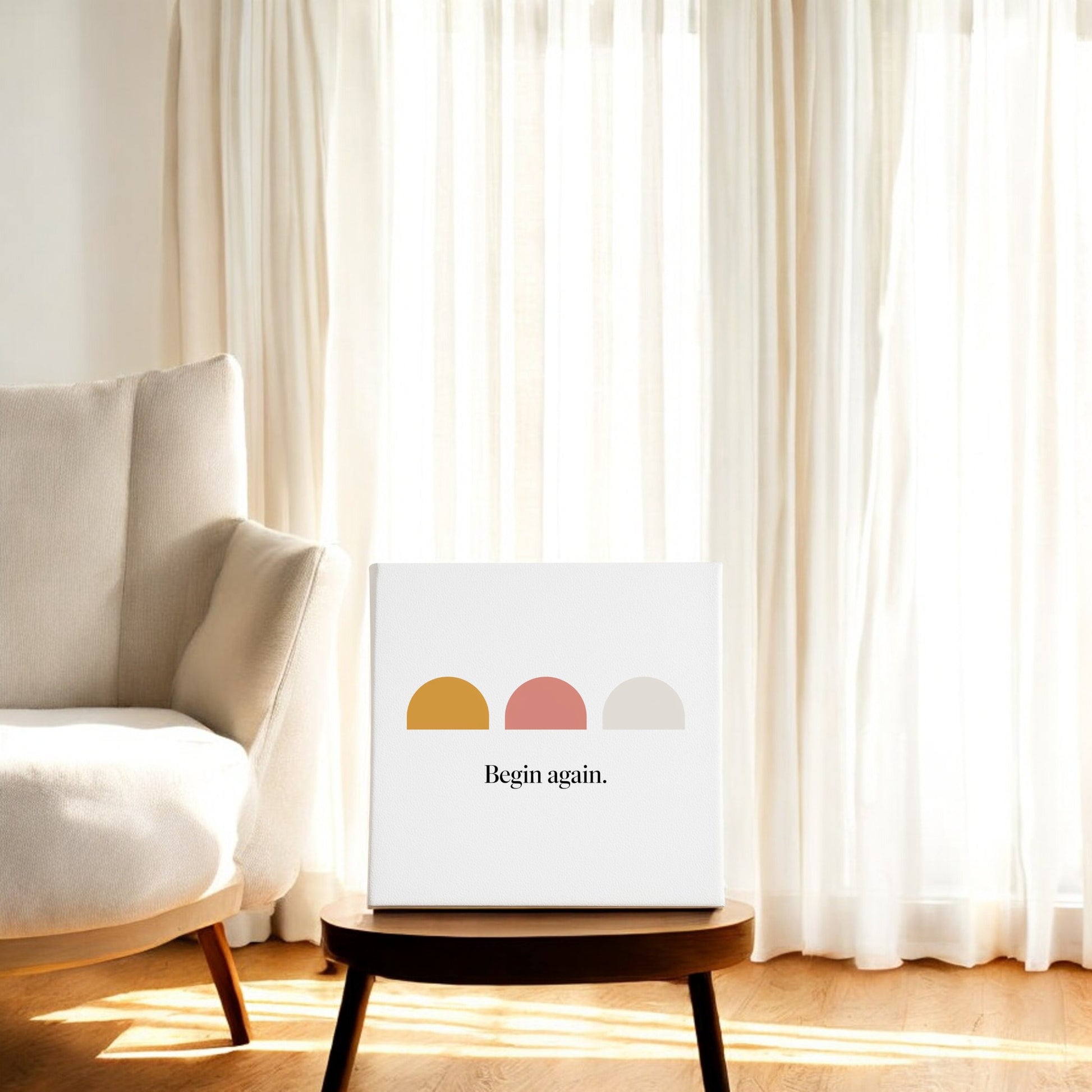 The Begin Again Canvas – Soft Summer Affirmation Wall Art by Mirabilia Boutique features abstract semi-circles in mustard, pink, and gray with the words "Begin again."—an inspiring, minimalist decor piece for any bright, modern space.