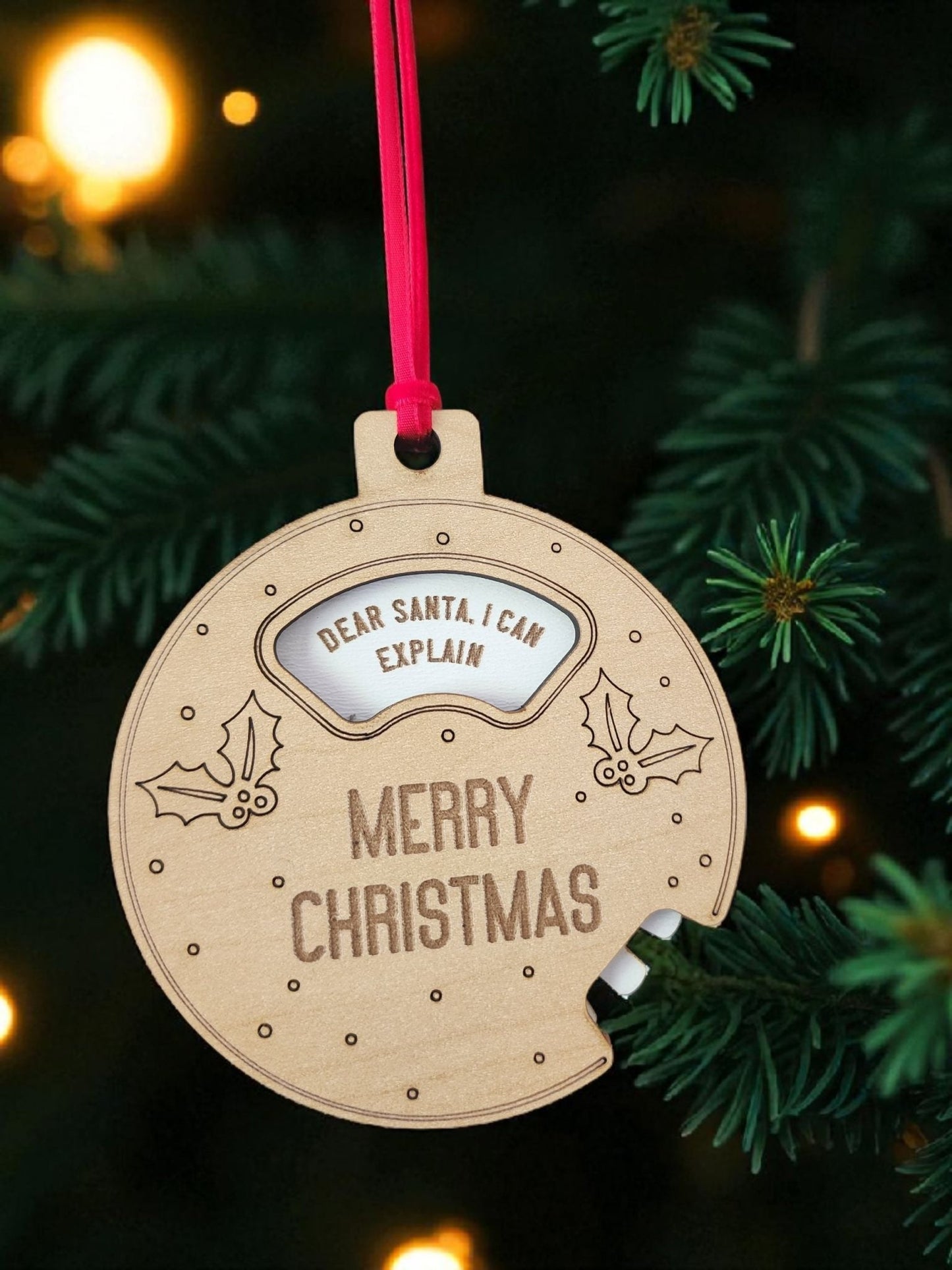 Add a playful touch to your tree with the Mirabilia Boutique Funny Geared Christmas Ornament, a wooden "Dear Santa Cookie Spinner" shaped like a bitten cookie with holly and “MERRY CHRISTMAS”—complete with red ribbon for hanging.