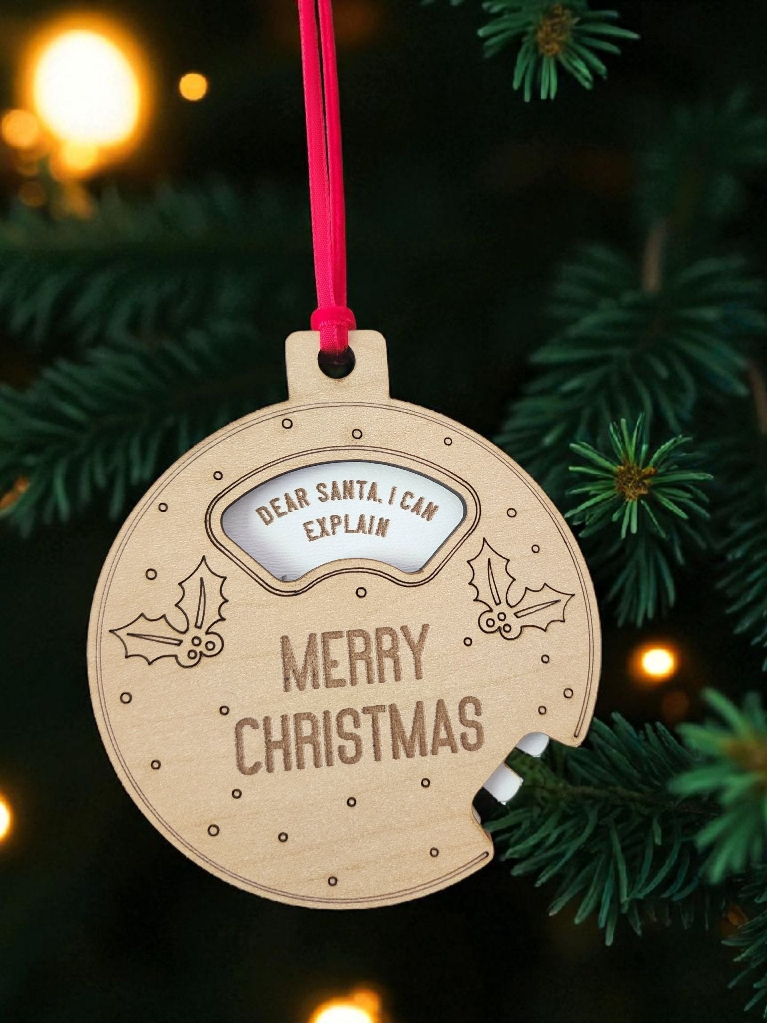 Add a playful touch to your tree with the Mirabilia Boutique Funny Geared Christmas Ornament, a wooden "Dear Santa Cookie Spinner" shaped like a bitten cookie with holly and “MERRY CHRISTMAS”—complete with red ribbon for hanging.