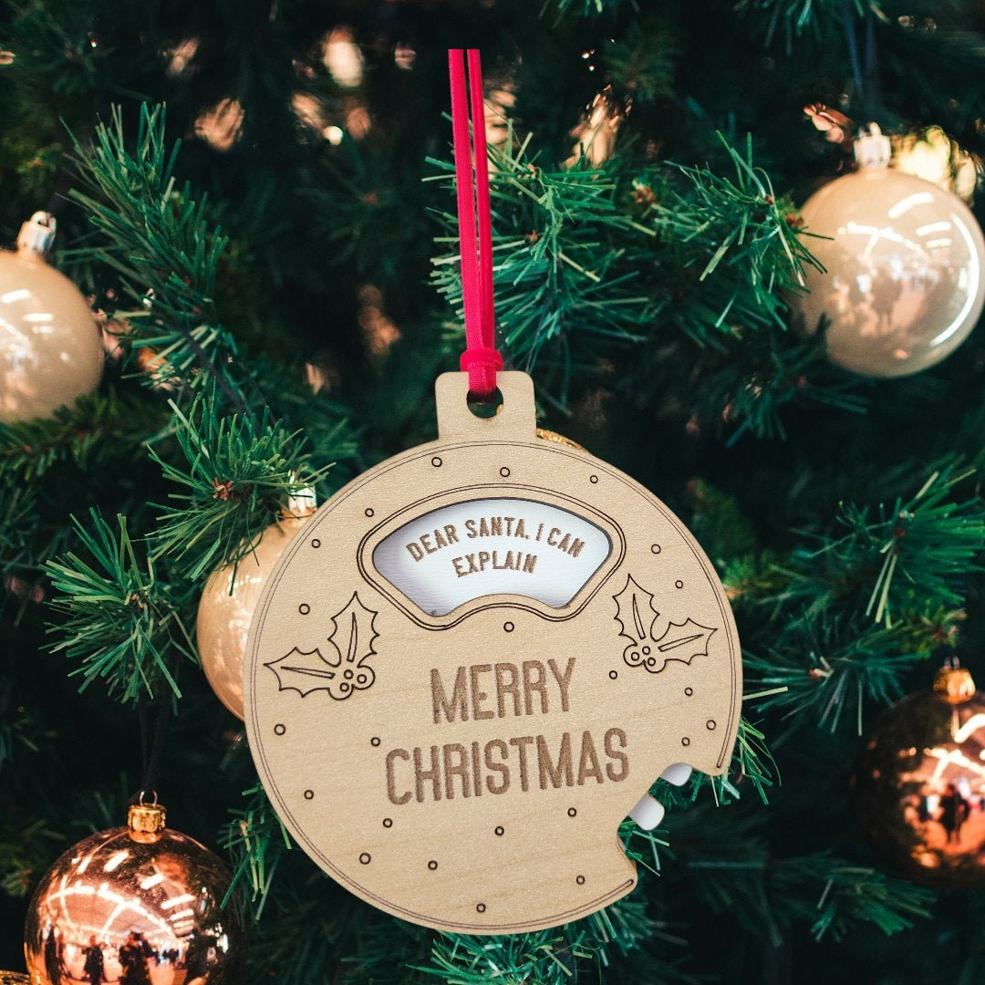 The Funny Geared Christmas Ornament by Mirabilia Boutique, called the "Dear Santa Cookie Spinner," features "DEAR SANTA, I CAN EXPLAIN" and "MERRY CHRISTMAS"—a wooden holiday ornament perfect for stockings or your Christmas tree.