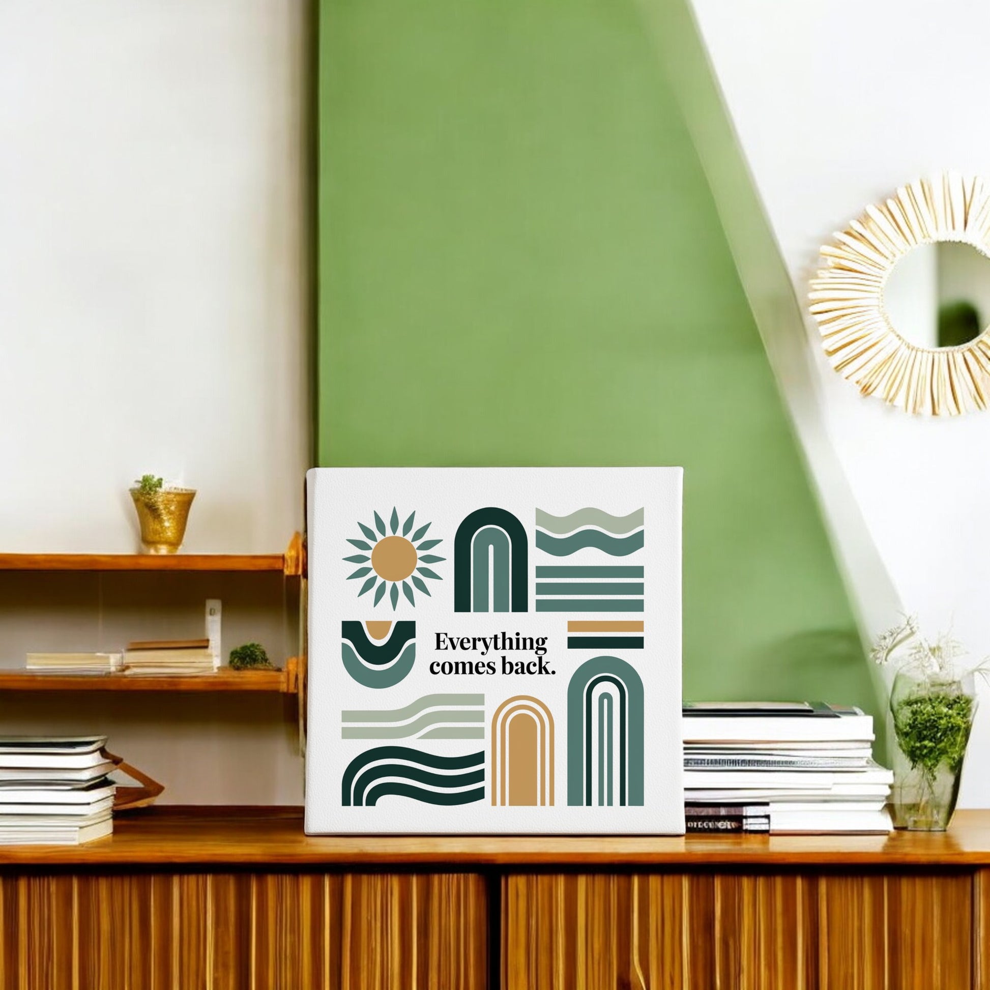 The Everything Comes Back Canvas – Earth Tone Wall Art by Mirabilia Boutique displays an inspirational quote and abstract design, making it a perfect decorative piece for modern rooms with green and white accents.