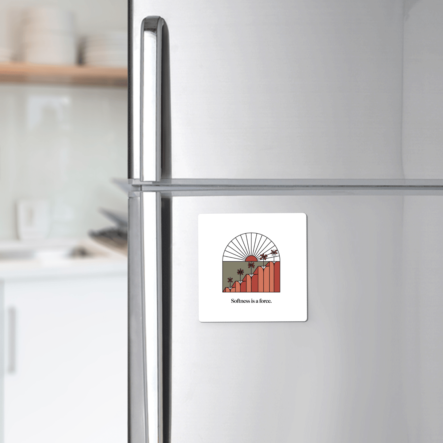 The "Softness Is a Force Abstract Floral Magnet" from Mirabilia Boutique is an empowering, stylish gift that adds inspiration and flair to any modern kitchen's stainless steel refrigerator.