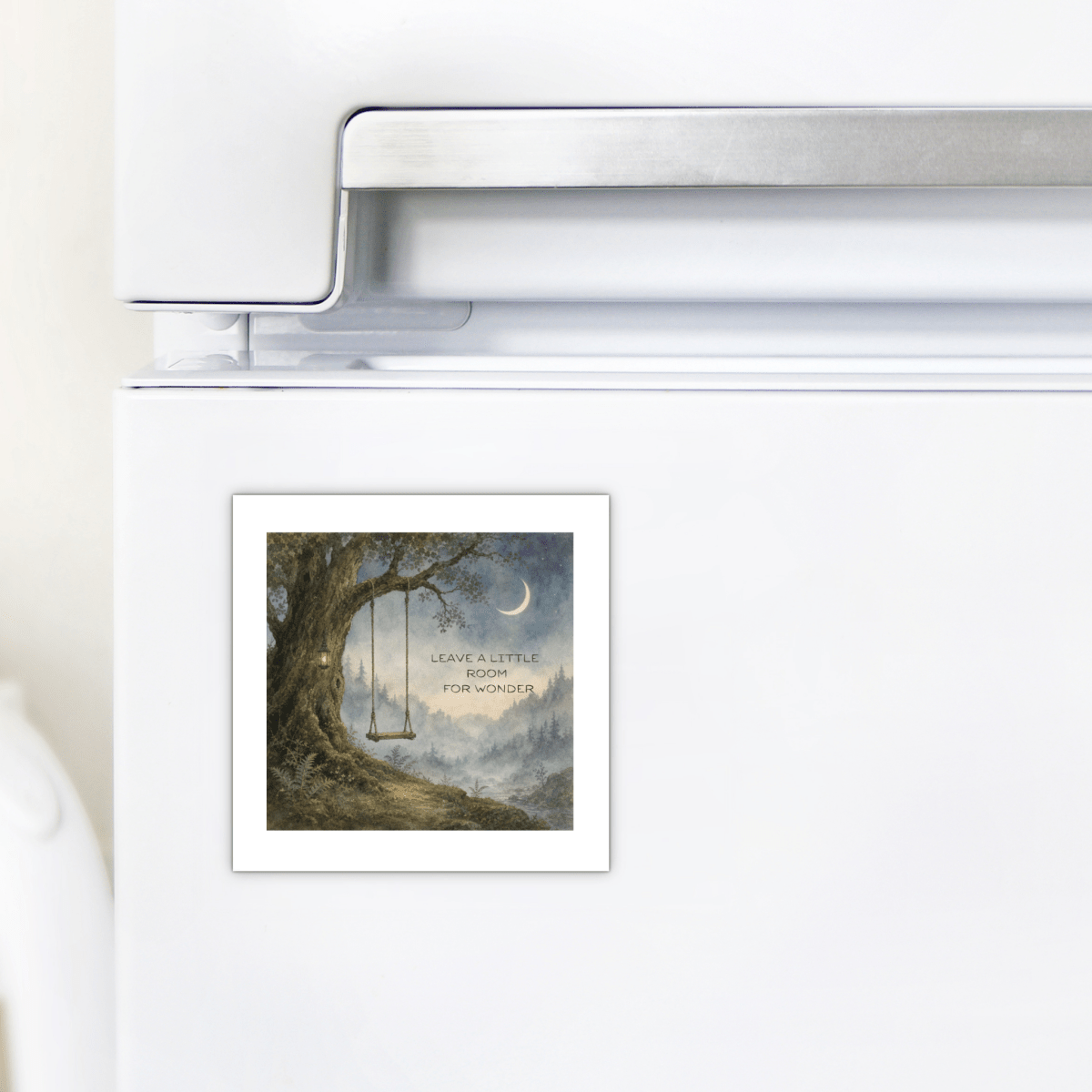 Enhance your kitchen décor with the Leave a Little Room for Wonder Magnet by Mirabilia Boutique—a charming fridge magnet featuring a tree, a swing, a crescent moon, and the inspirational message “Leave a little room for wonder,” perfect for creating a nature-inspired atmosphere in your home.