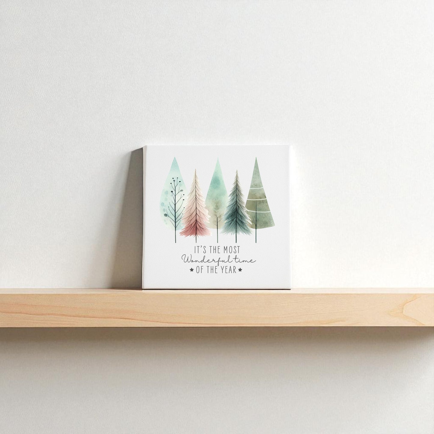 The Most Wonderful Time of Year Canvas | Pastel Watercolor Trees by Mirabilia Boutique features charming tree illustrations and festive text—ideal winter decor for your shelf or wall.