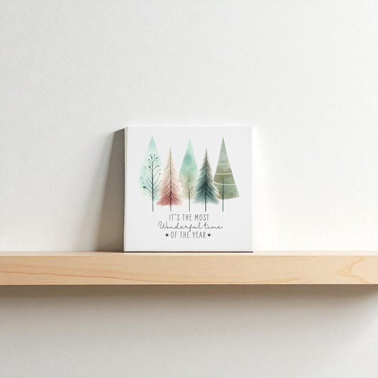 The Most Wonderful Time of Year Canvas | Pastel Watercolor Trees by Mirabilia Boutique features charming tree illustrations and festive text—ideal winter decor for your shelf or wall.
