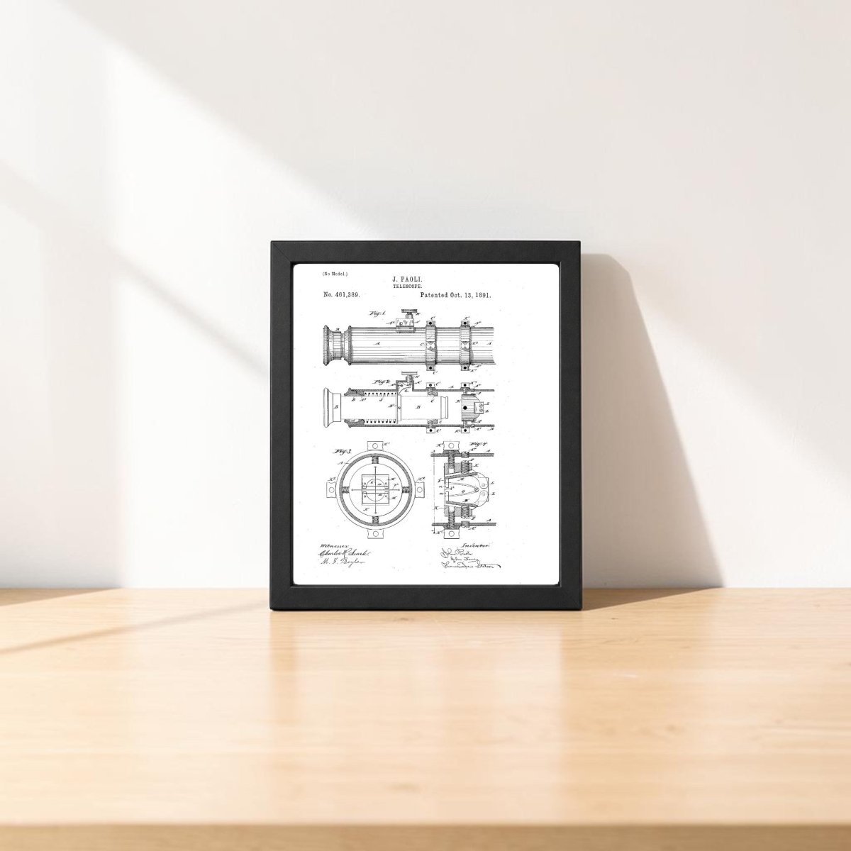 Mirabilia Boutique’s Nautical Telescope Patent Art Print, a framed black-and-white technical drawing, sits on light wood with soft sunlight—ideal nautical or maritime decor.