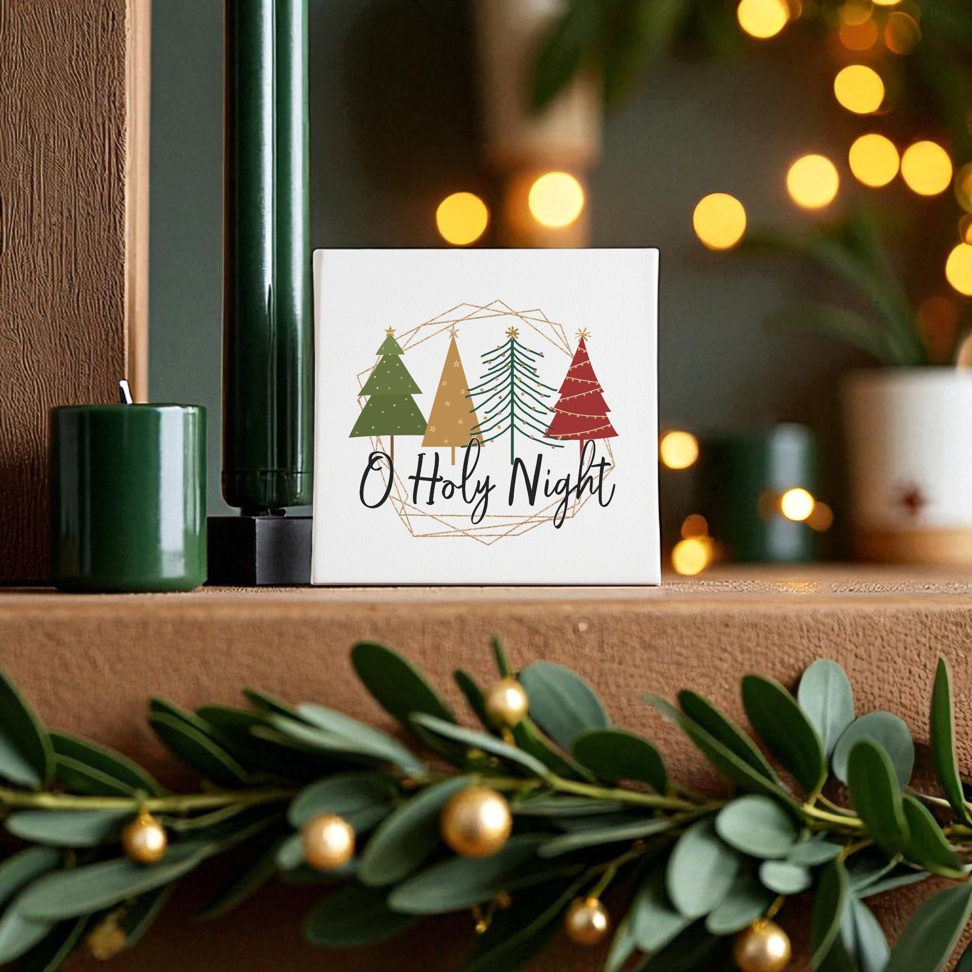 The O Holy Night Canvas Sign (8x8) from Mirabilia Boutique brings faith-inspired charm to your mantel or wall, blending perfectly with green candles, warm string lights, and gold-accented garland for elegant minimalist Christmas decor.