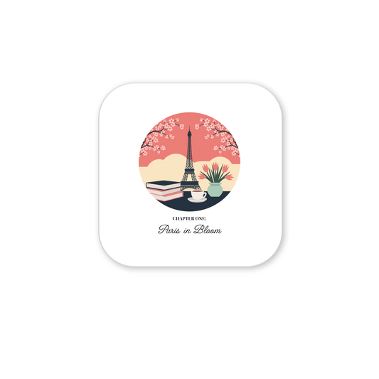 The Paris in Bloom Magnet by Mirabilia Boutique features the Eiffel Tower, cherry blossoms, books, coffee cup, and plant with "CHAPTER ONE: Paris in Bloom" on a soft pink and beige circle—ideal for book lovers or as cherry blossom decor.