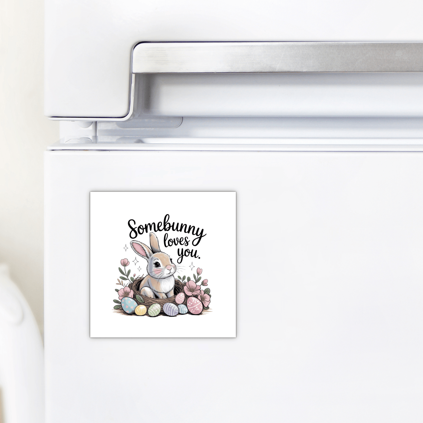 The Mirabilia Boutique "Somebunny Loves You Magnet – Cute Spring Bunny Gift" features a bunny, pastel eggs, and flowers. This charming square magnet brings a touch of spring to any fridge decor.