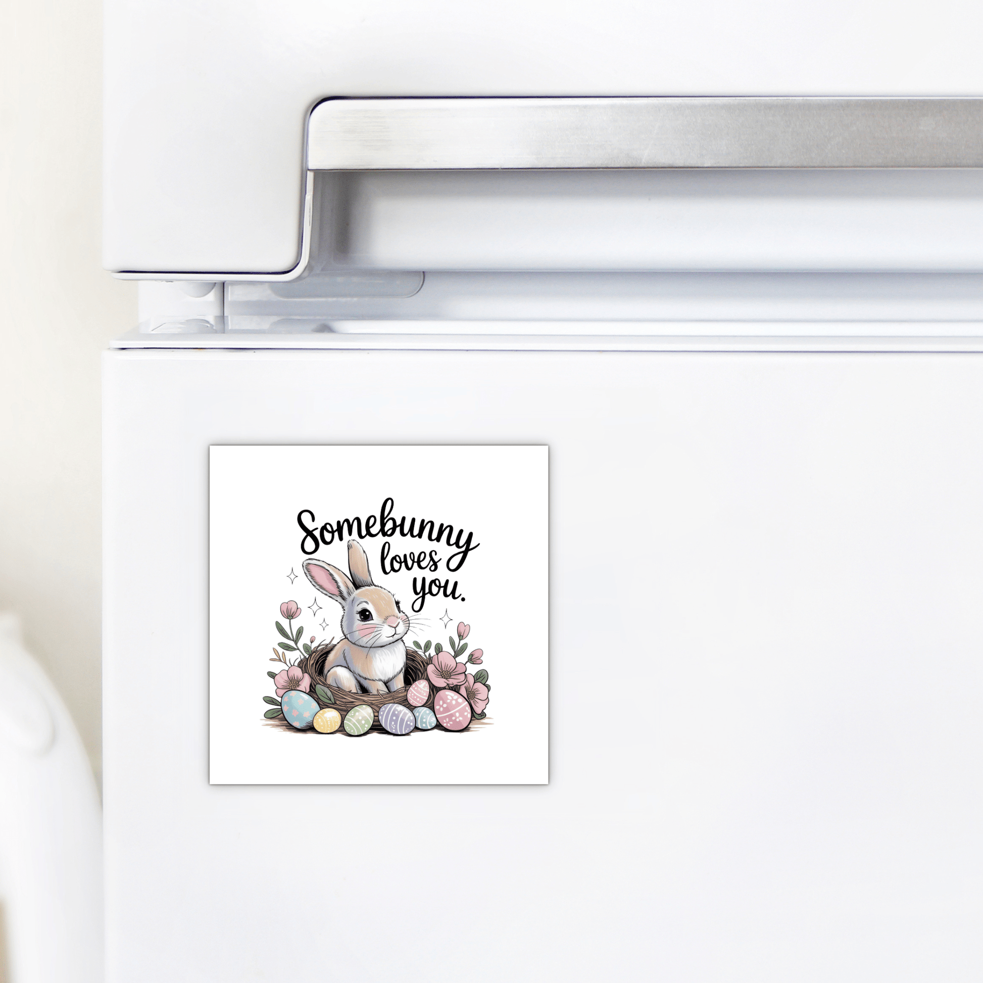 The Mirabilia Boutique "Somebunny Loves You Magnet – Cute Spring Bunny Gift" features a bunny, pastel eggs, and flowers. This charming square magnet brings a touch of spring to any fridge decor.