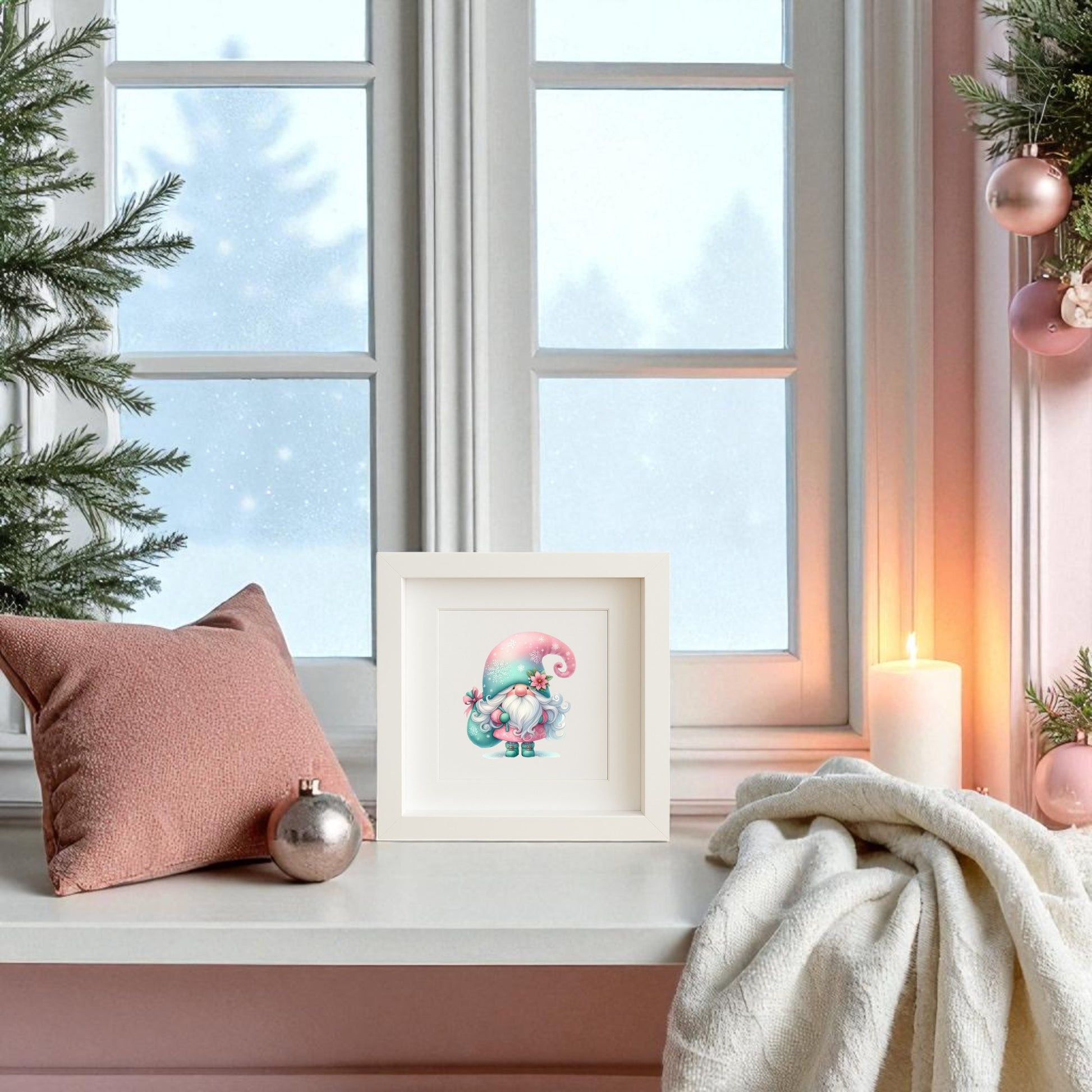 A cozy window seat features a pink pillow, white blanket, candle, Christmas ornaments, and evergreen branches, with frosted windows. Pastel Gnome Wall Art | Teal Hat Winter Print by Mirabilia Boutique adds Scandinavian festive charm.