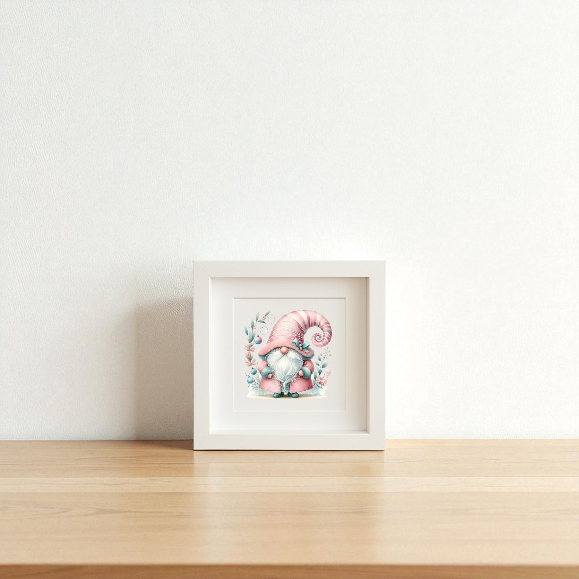 The "Pastel Gnome Wall Art" by Mirabilia Boutique adds whimsical nursery charm with a pink-hat gnome in blue, surrounded by flowers—perfect holiday or nursery decor for a light wooden surface and white wall.