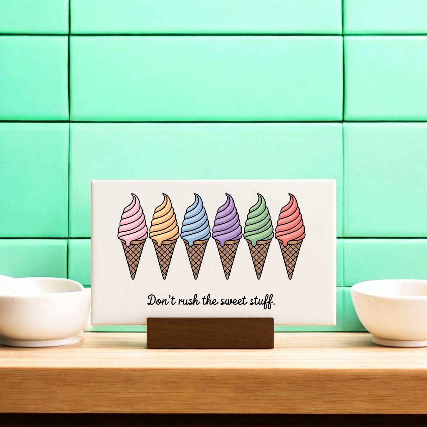 The “Don’t Rush the Sweet Stuff – Canvas Ice Cream Sign” by Mirabilia Boutique features six colorful cones and playful text, perfect for adding cheerful ice cream art to your mint green pastel home decor.
