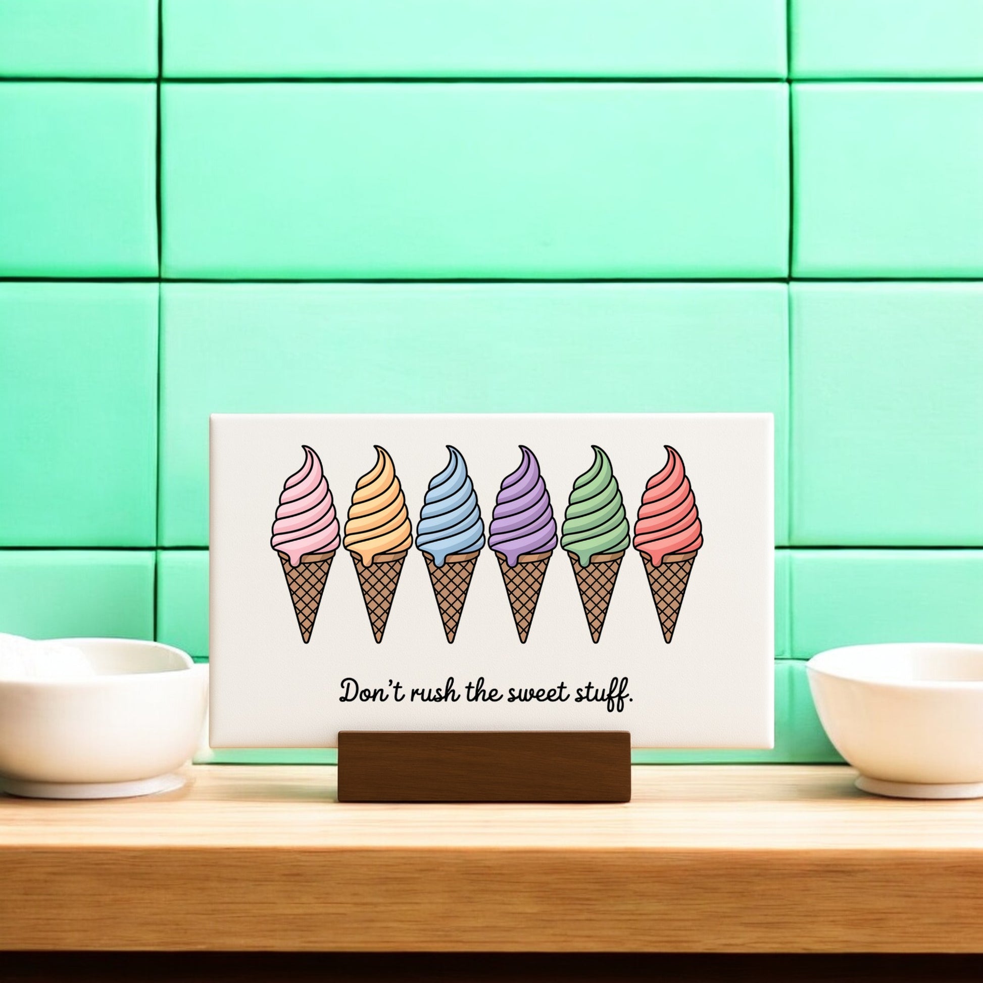 The “Don’t Rush the Sweet Stuff – Canvas Ice Cream Sign” by Mirabilia Boutique features six colorful cones and playful text, perfect for adding cheerful ice cream art to your mint green pastel home decor.