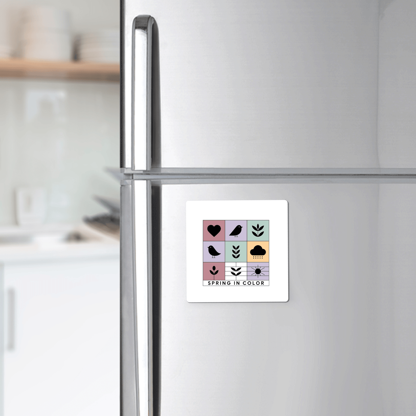The Mirabilia Boutique Spring in Color Magnet – Whimsical Pastel Icons brightens up a stainless steel fridge in a modern kitchen, making it an ideal seasonal gift.