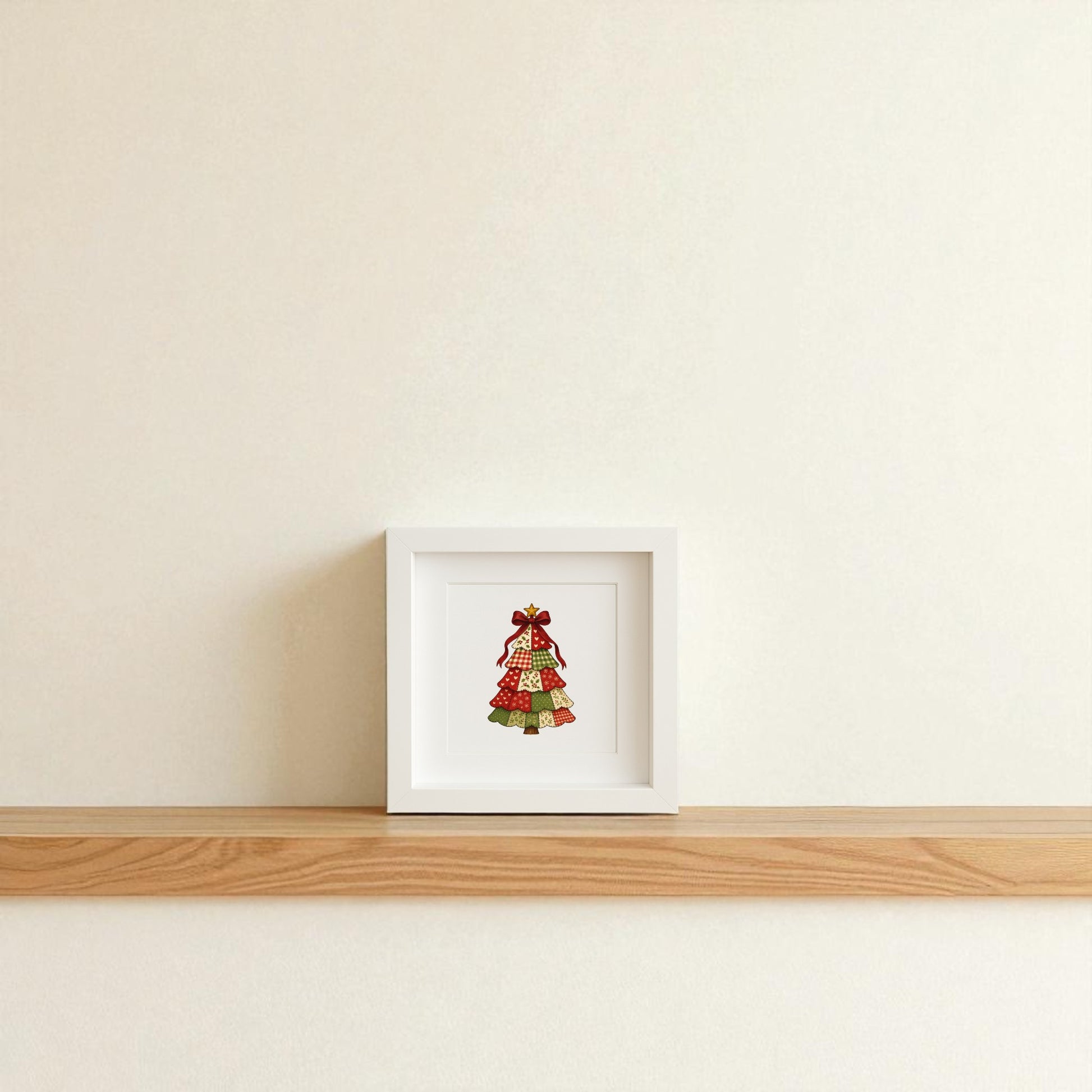 The Patchwork Christmas Tree Sign by Mirabilia Boutique is a 5x5 shadowbox featuring a patterned tree topped with a red bow, perfect as charming farmhouse holiday decor for your wall or shelf.