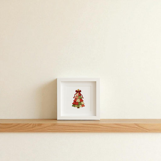 The Patchwork Christmas Tree Sign by Mirabilia Boutique is a 5x5 shadowbox featuring a patterned tree topped with a red bow, perfect as charming farmhouse holiday decor for your wall or shelf.
